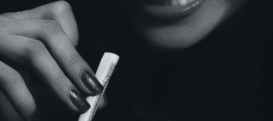 woman holding a blunt