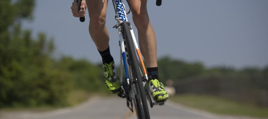 person riding road bike on the road