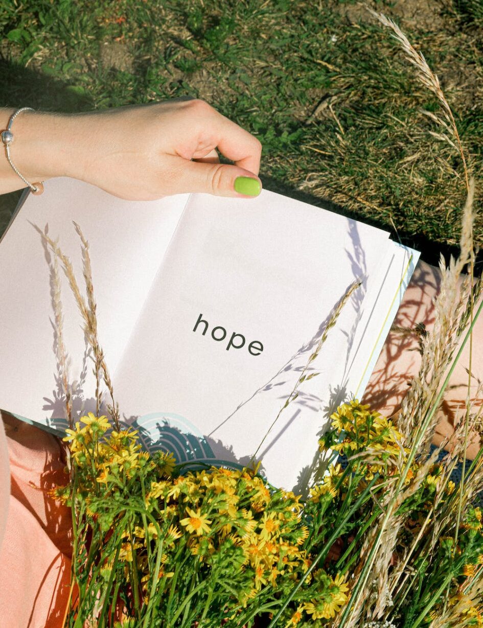 a person holding an open book